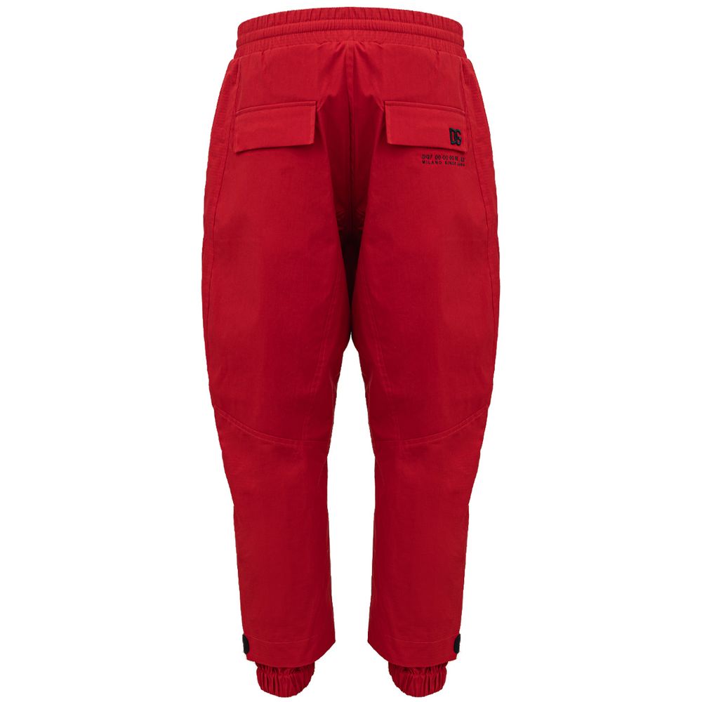 Pantalon de sport rouge en polyamide Dolce & Gabbana, style athlétique avec logo de la marque visible.