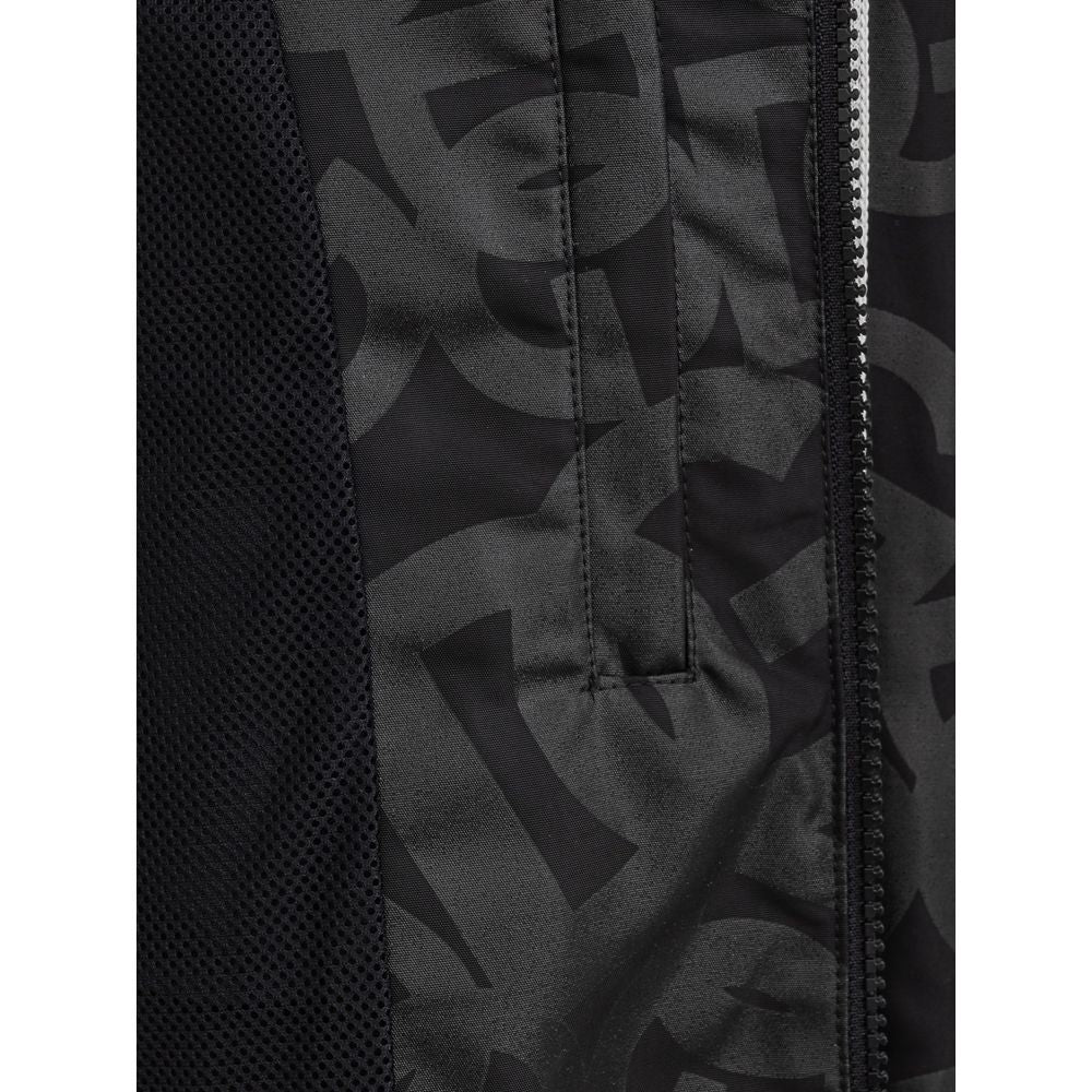 Veste en polyester noire de Dolce & Gabbana, coupe élégante, avec détails modernes et finition soignée.
