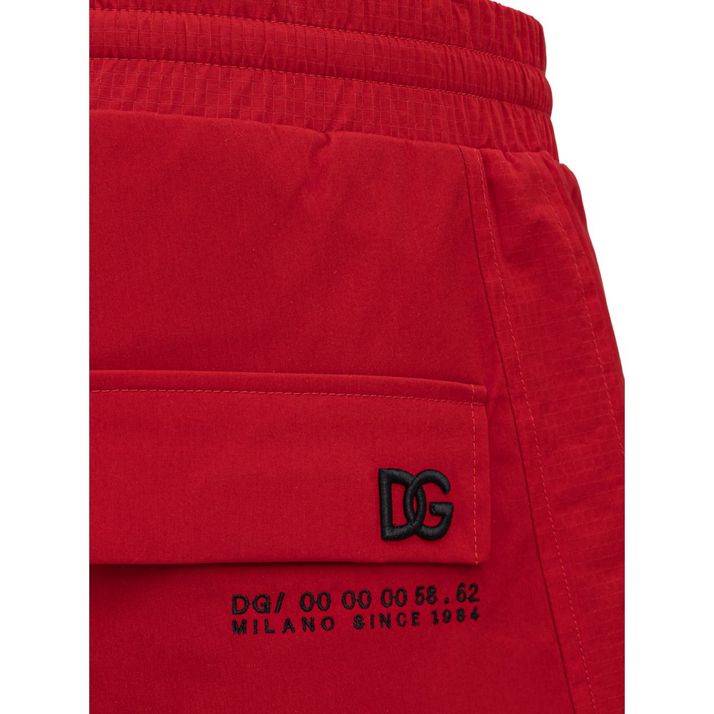 Pantalons de sport en polyamide rouges Dolce & Gabbana pour homme, détails de la taille et style athlétique visibles.