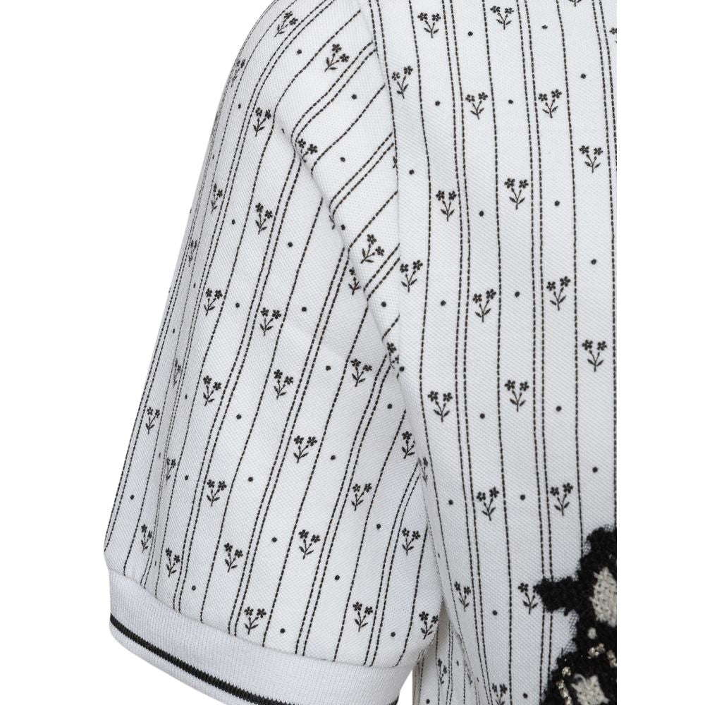 Chemise polo blanche en coton de Dolce & Gabbana, vue de face, élégante et classique avec col et boutons.