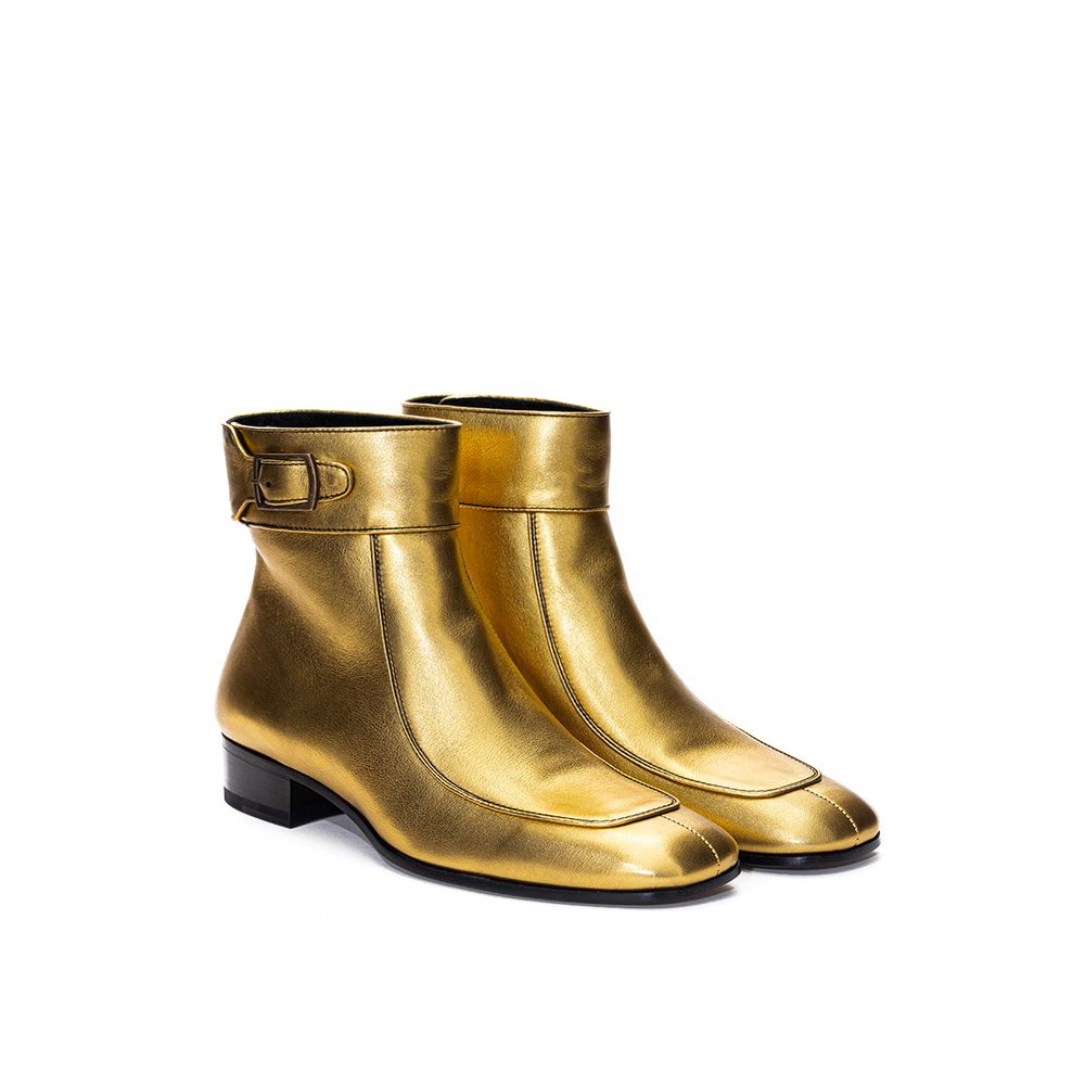 Bottines à talons en cuir doré de Saint Laurent, ankle boots élégantes avec finition brillante et design moderne.