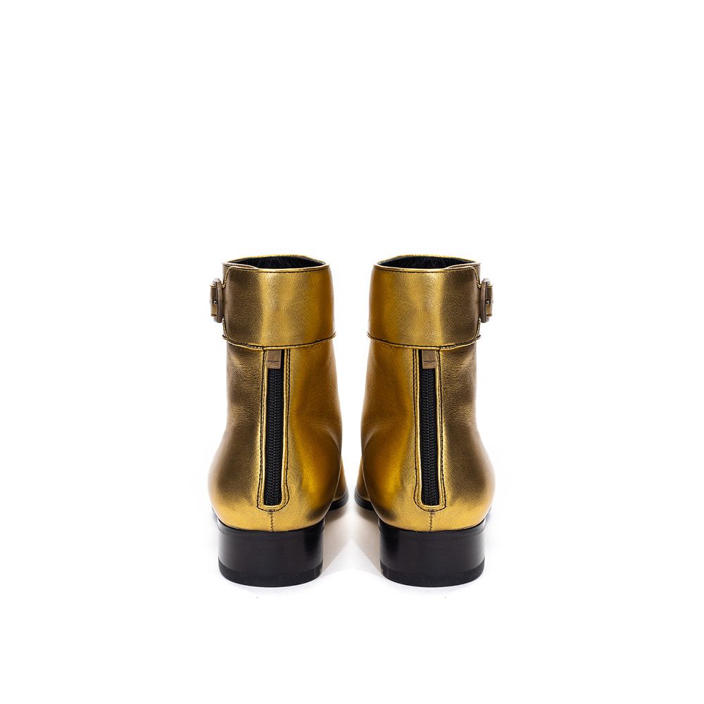 Bottes de cheville en cuir doré de Saint Laurent, style élégant et moderne.