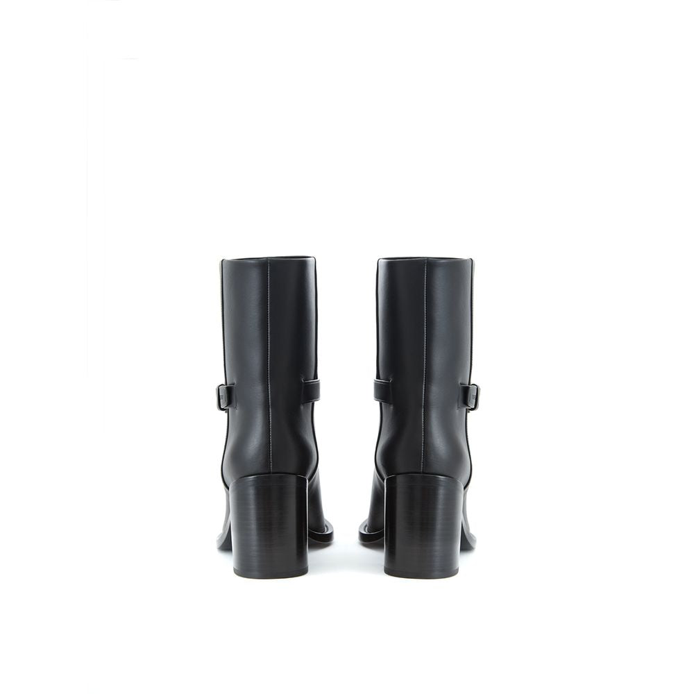 Bottes Chelsea noires en cuir de Burberry, finition élégante et semelle robuste, pour un look sophistiqué.