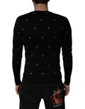 Pull à col rond Dolce & Gabbana noir avec motif ananas en maille, style décontracté et élégant.