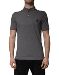 T-shirt polo gris Dolce & Gabbana en coton avec col en forme de couronne, vue de face.