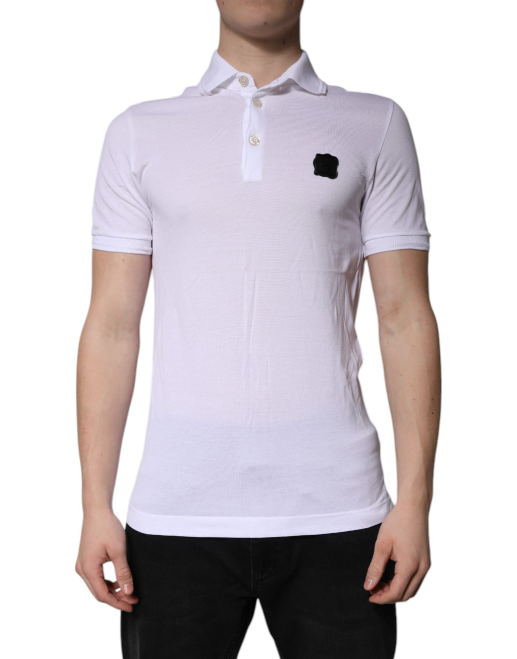 T-shirt polo blanc en coton Dolce & Gabbana avec col et logo visible sur la poitrine.