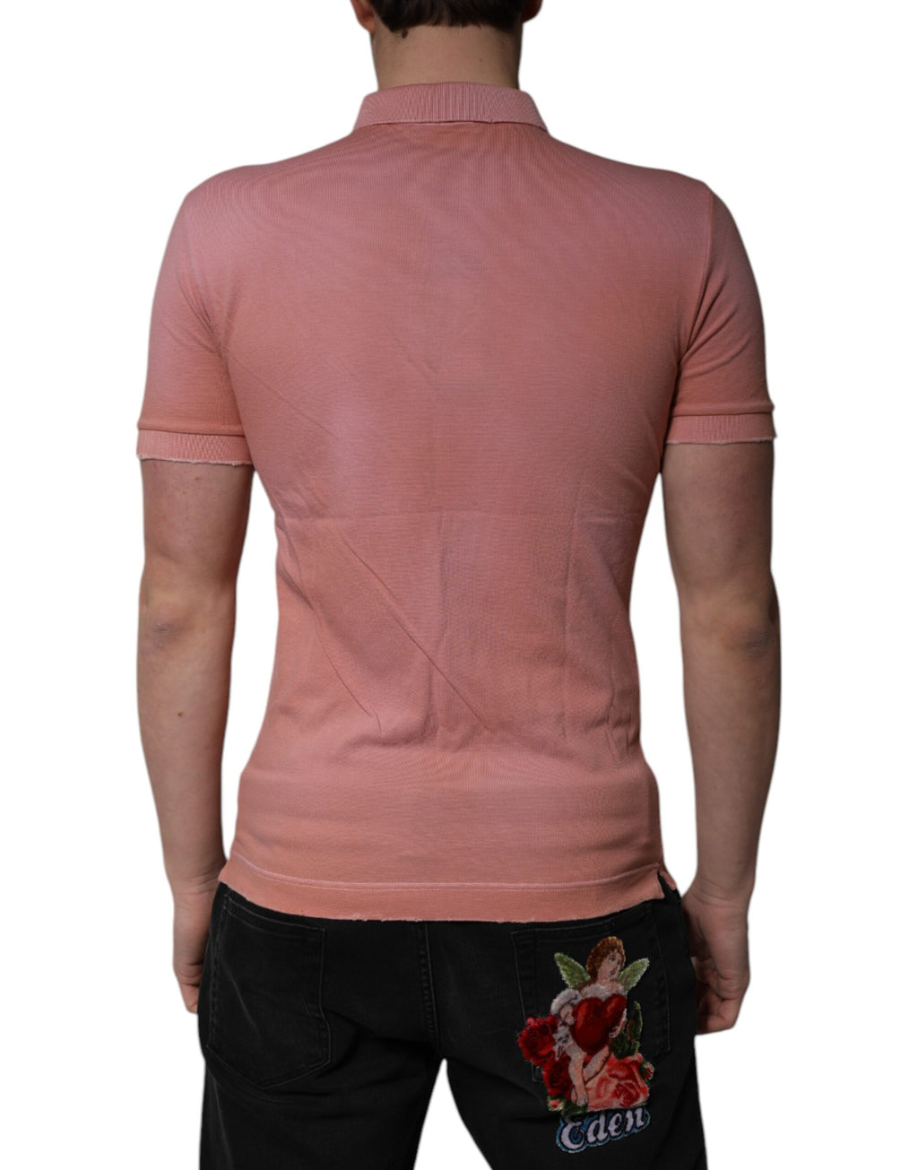 T-shirt polo Dolce & Gabbana en coton rose avec col à couronne, vue de face.