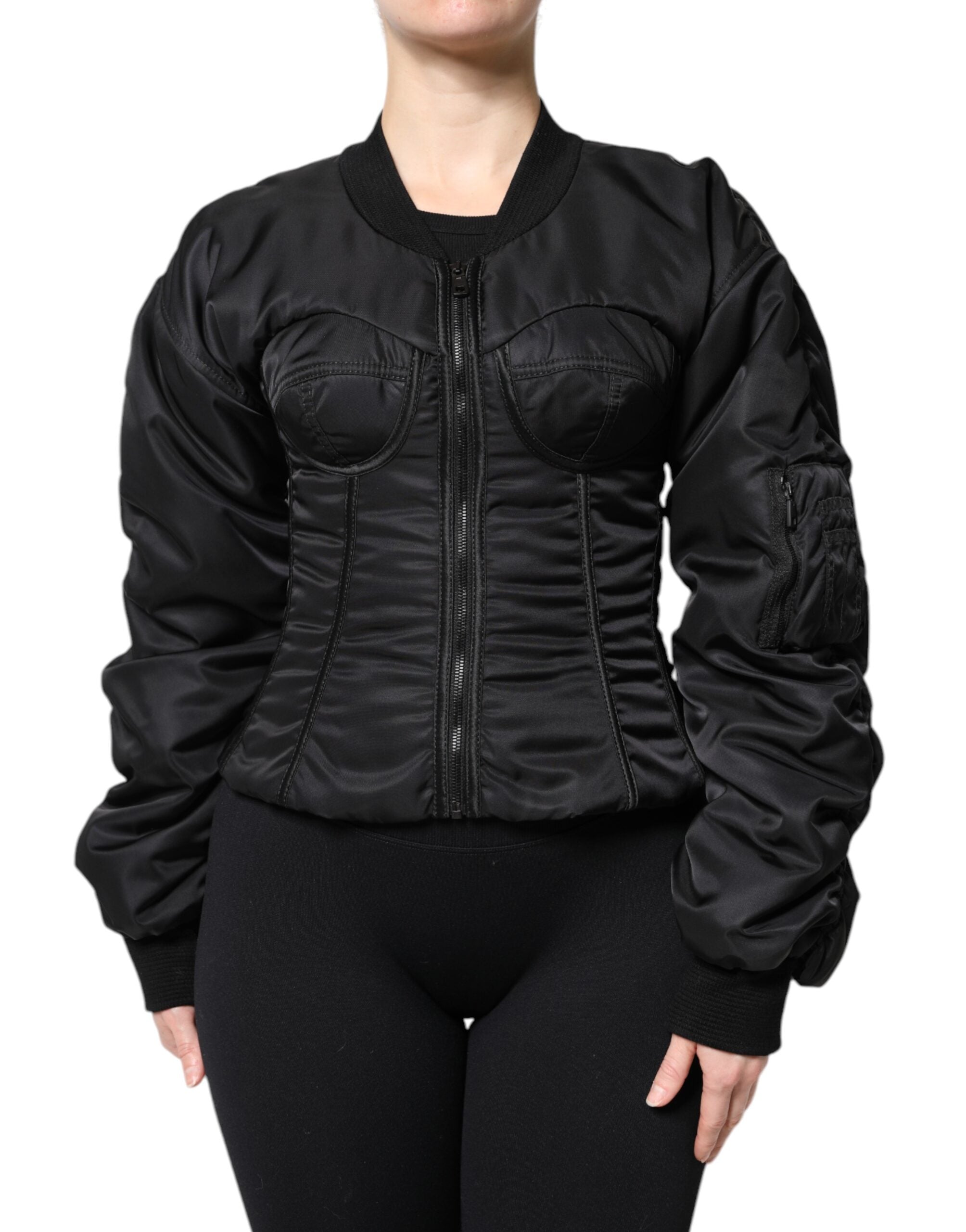 Veste corset noire en nylon Dolce & Gabbana avec fermeture éclair complète et bustier ajusté, détails élégants et structurés.