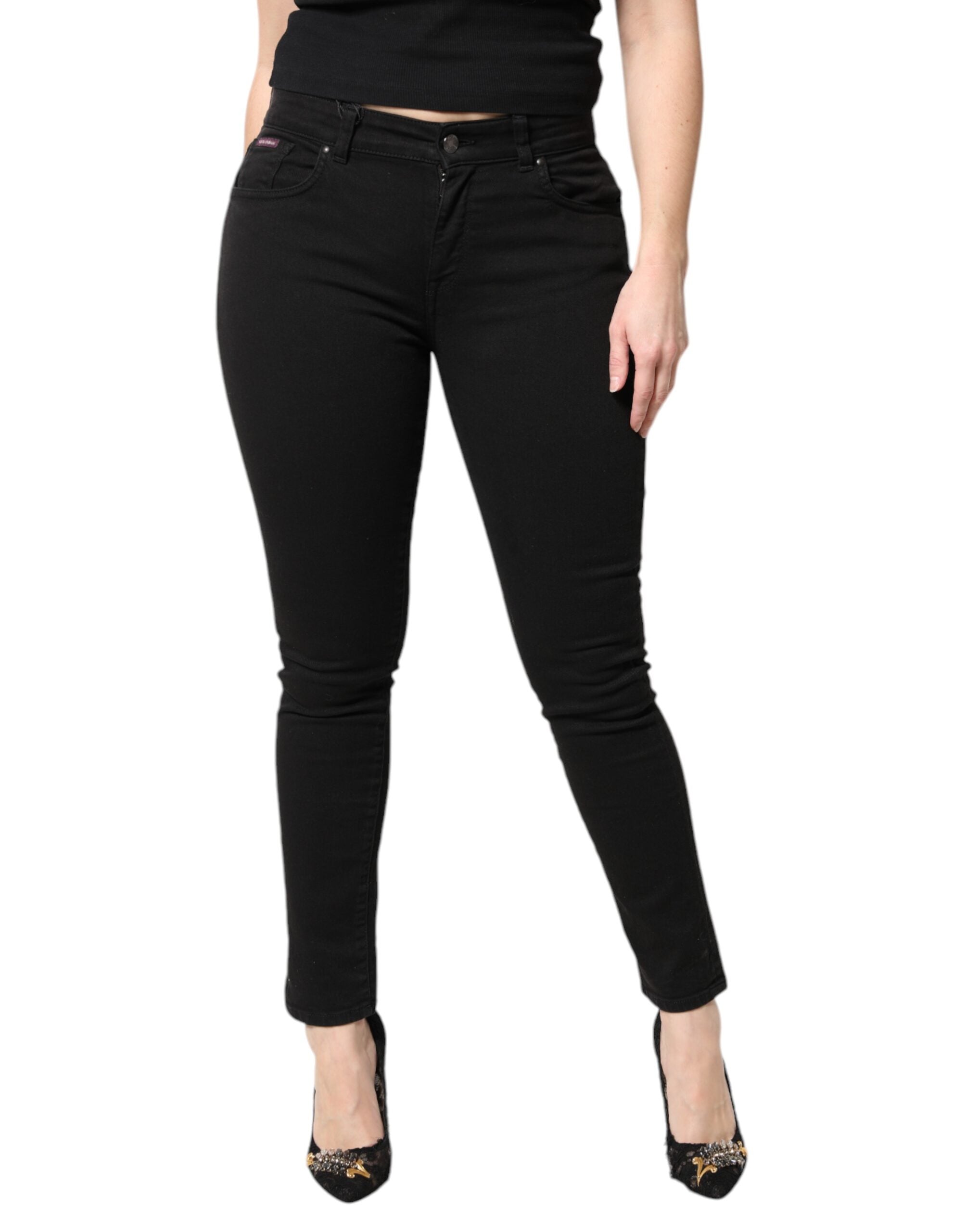 Jeans skinny en coton noir à taille moyenne de Dolce & Gabbana, coupe ajustée et moderne, visibles en détail sur l'image.