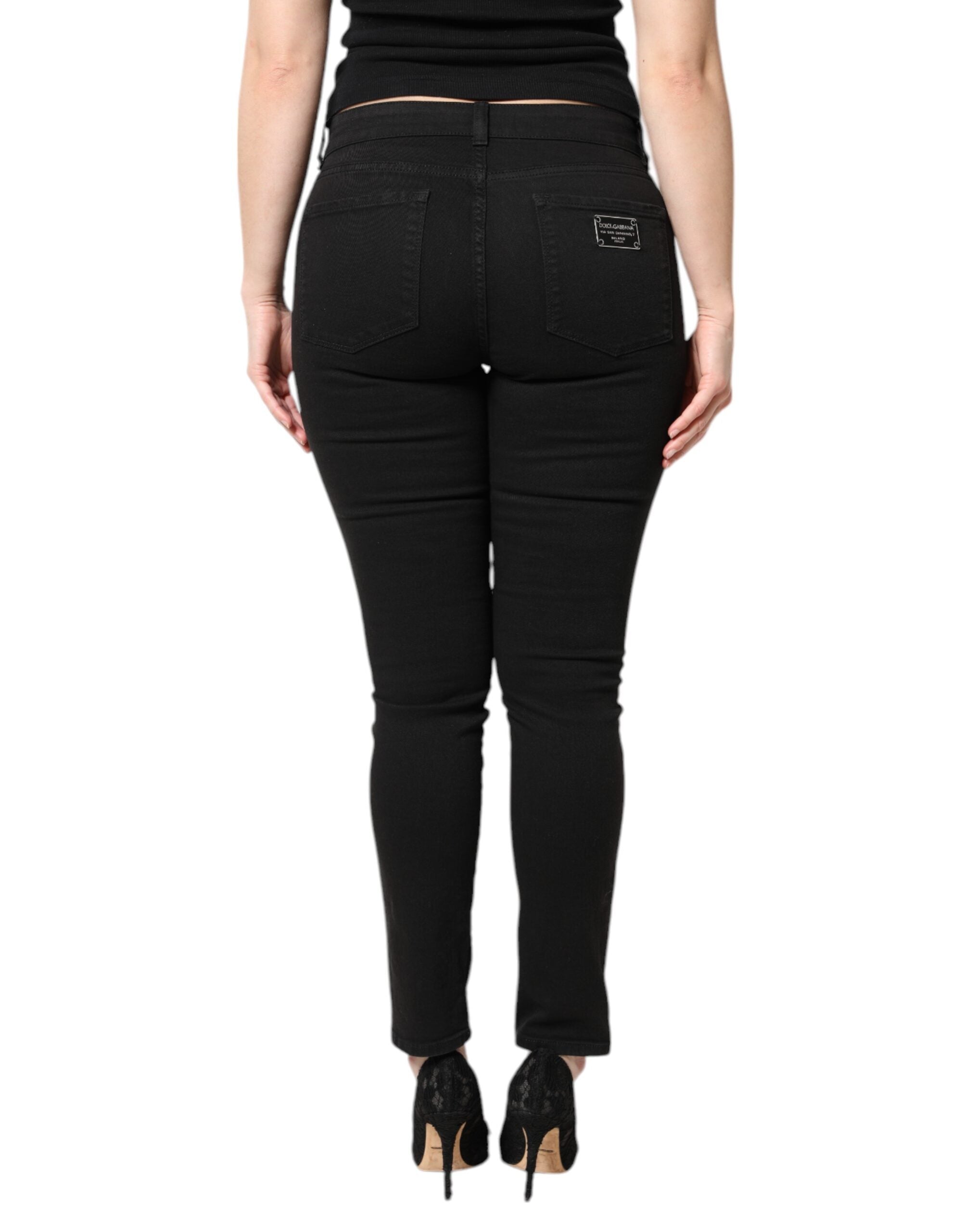 Jeans skinny en coton noir Dolce & Gabbana, taille mi-haute, coupe ajustée, détails classiques et denim de haute qualité.