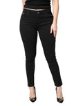 Jeans skinny en coton noir à taille moyenne de Dolce & Gabbana, coupe ajustée, visible sur un fond neutre.