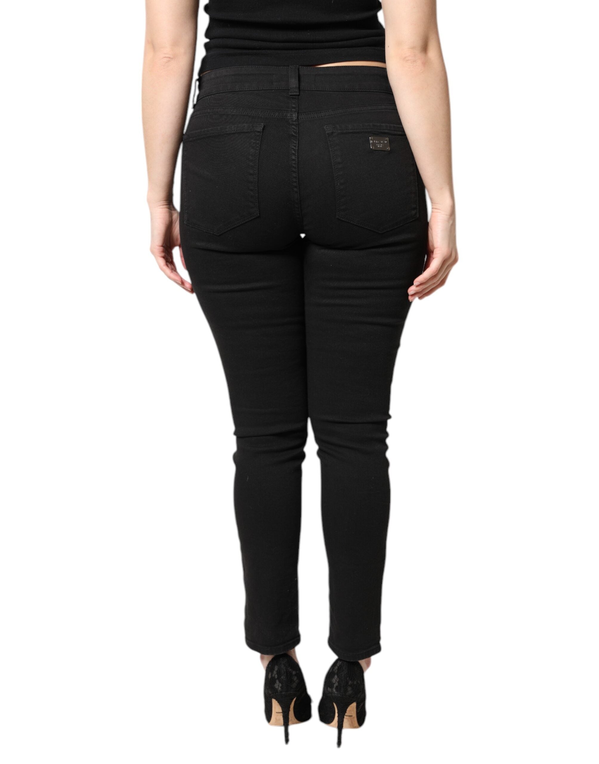 Jeans skinny en denim noir à taille moyenne de Dolce & Gabbana, coupe ajustée et tissu en coton durable.