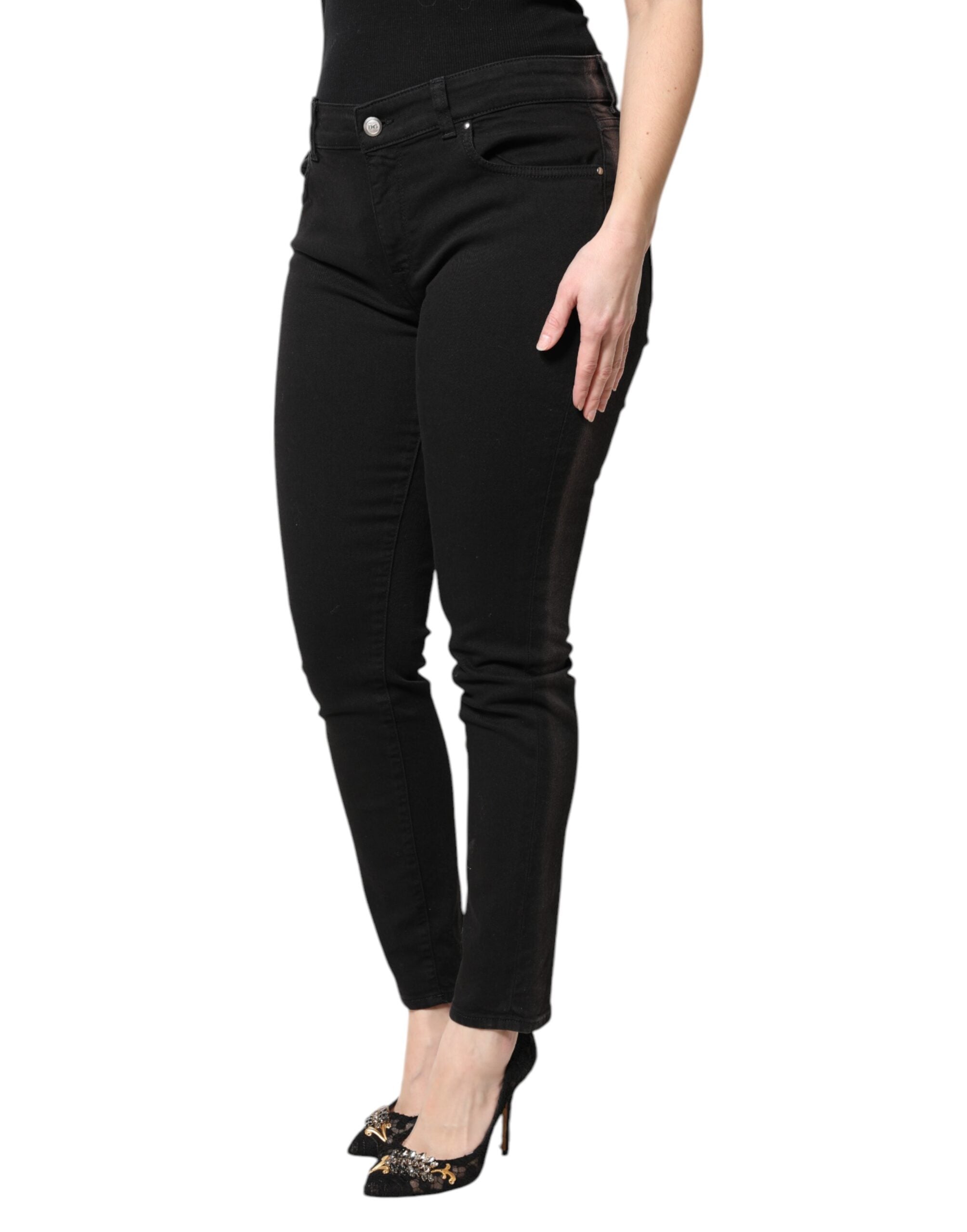 Jeans skinny en denim noir à taille moyenne de Dolce & Gabbana, coupe ajustée et style moderne.