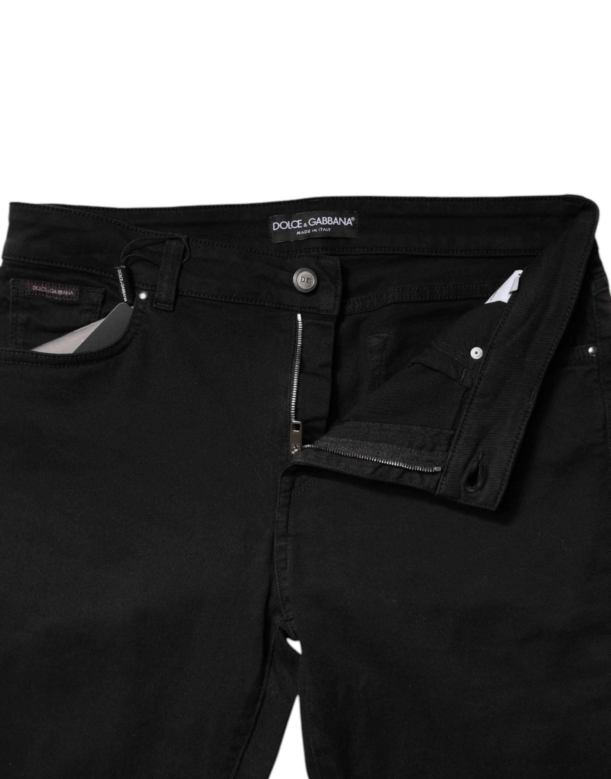 Jeans skinny en coton noir à taille moyenne de Dolce & Gabbana, coupe ajustée et moderne, visibles en image.