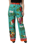 Pantalon droit en soie verte imprimée de Dolce & Gabbana, style élégant et confortable, visible en détail sur l'image.