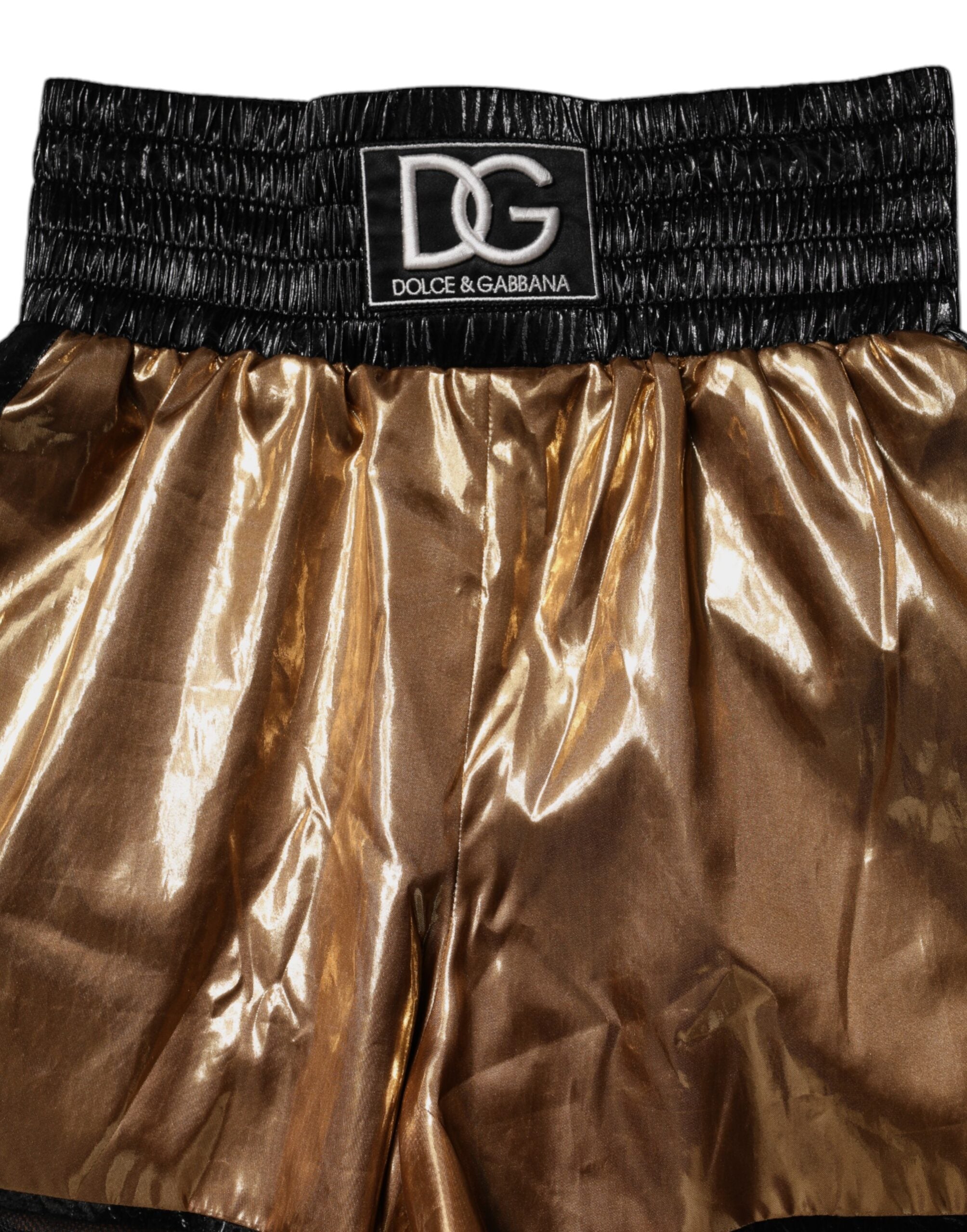 Shorts dorés métalliques à taille haute pour femmes de Dolce & Gabbana, style chic et tendance.