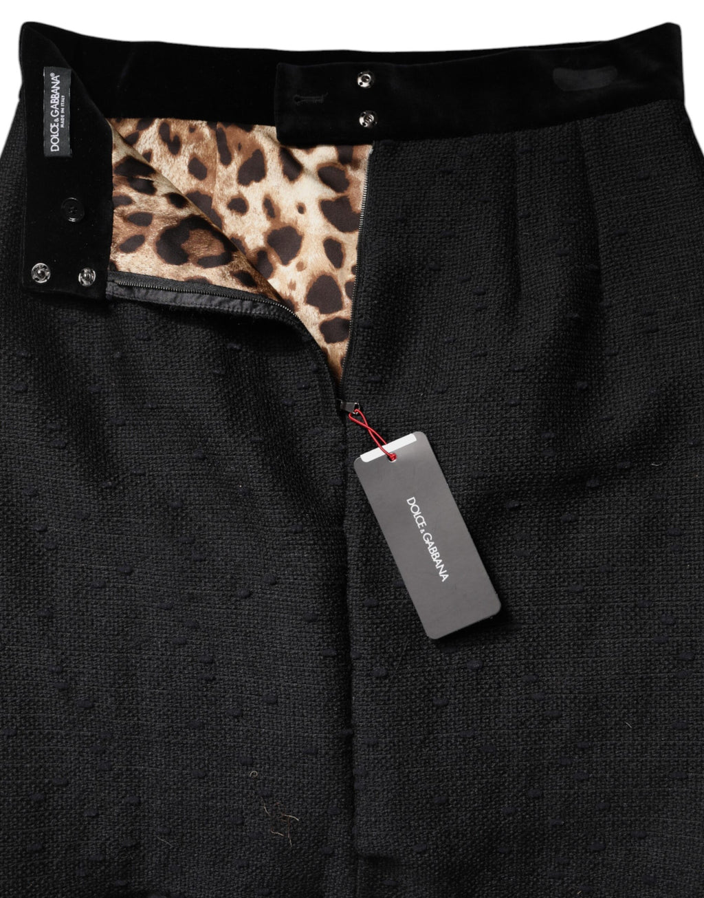 Jupe mini crayon en laine noire Dolce & Gabbana avec franges à taille haute, élégante et tendance.