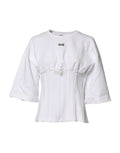 Blouse Dolce & Gabbana en coton blanc avec manches 3/4, élégante et légère, portée décontractée ou chic.