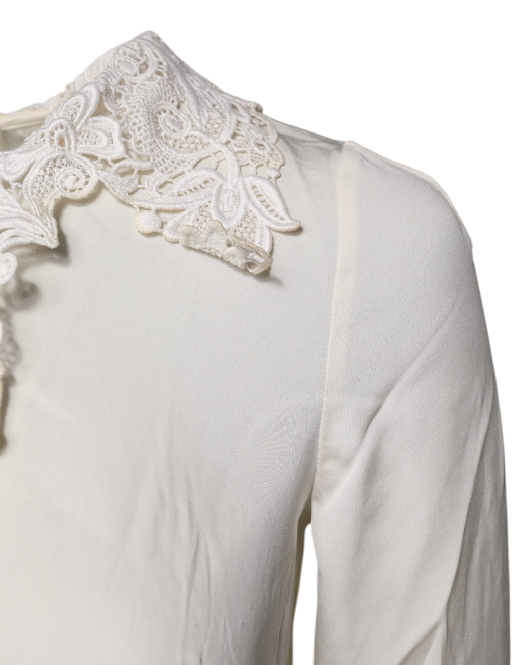 Blouse Dolce & Gabbana en dentelle florale crème à manches longues, élégante et raffinée, vue de face.
