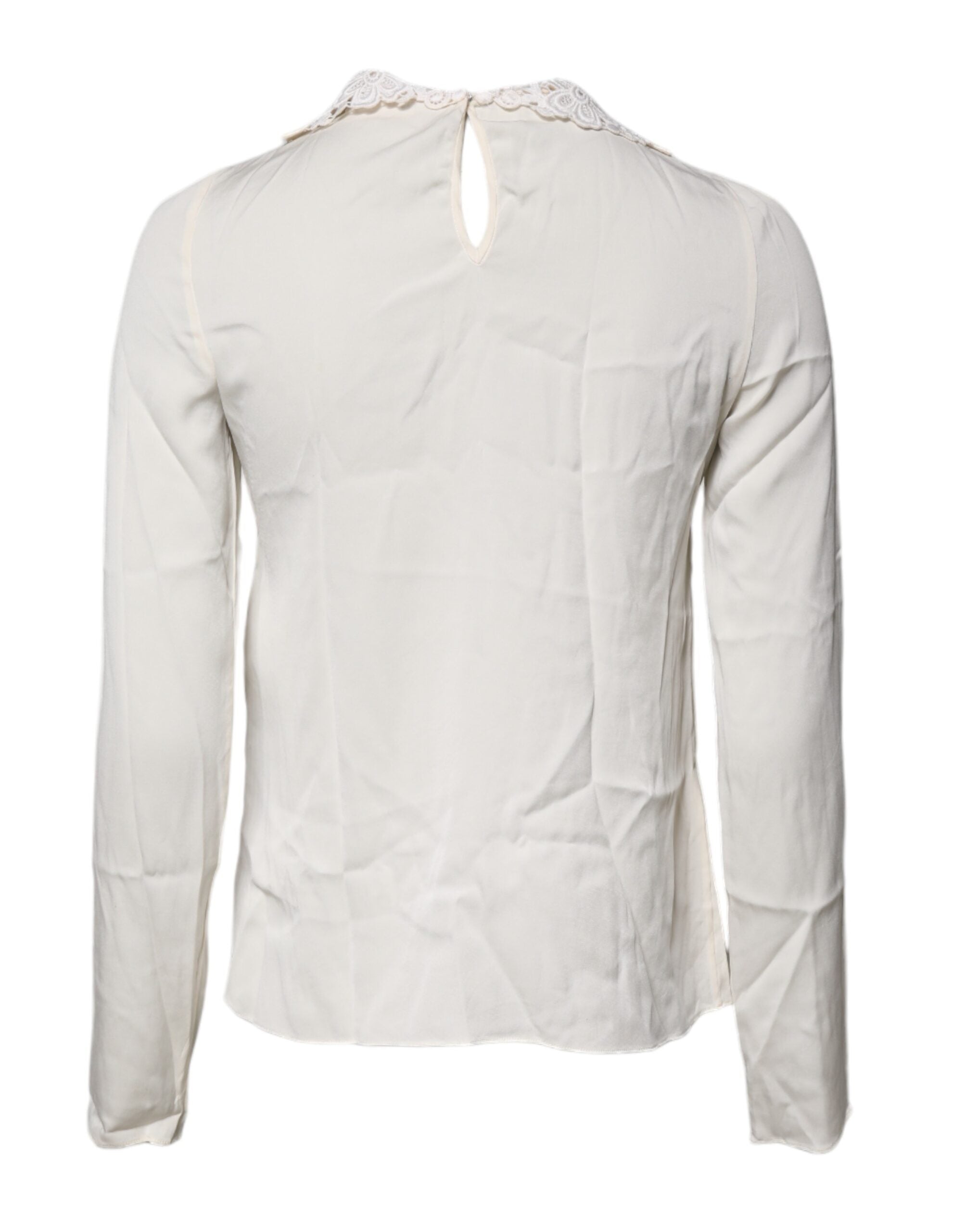 Blouse Dolce & Gabbana en dentelle florale crème à manches longues, élégante et raffinée, vue de face.