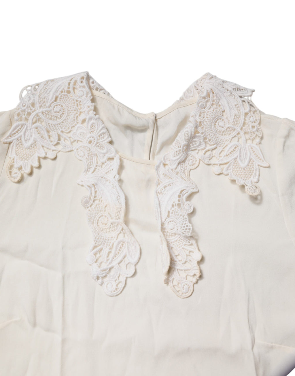Blouse Dolce & Gabbana en dentelle florale crème à manches longues, élégante et raffinée pour femmes.