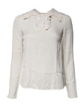Blouse Dolce & Gabbana en dentelle florale crème à manches longues, élégante et raffinée, vue de face.