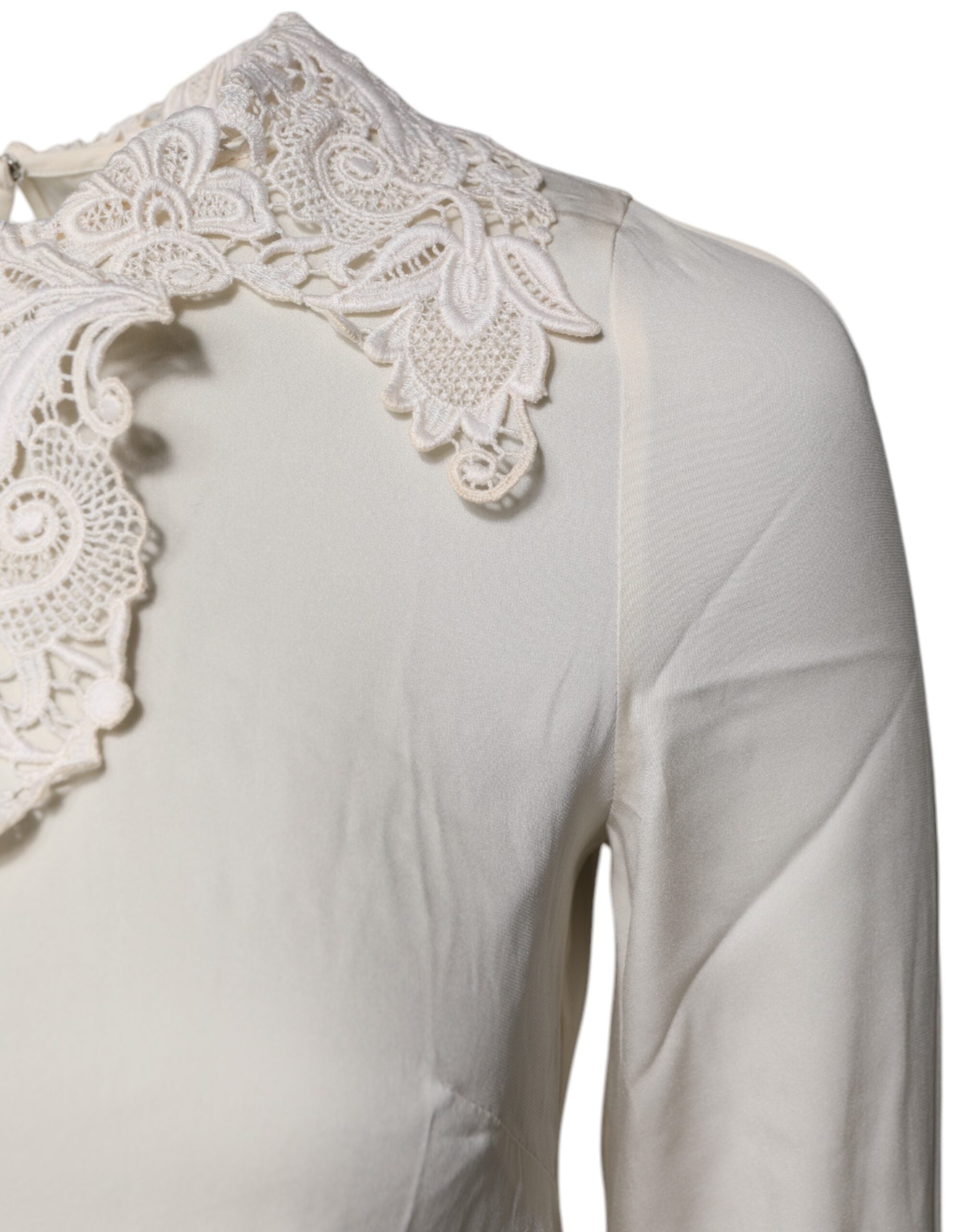 Blouse Dolce & Gabbana en dentelle florale crème à manches longues et col en V, élégante et raffinée.