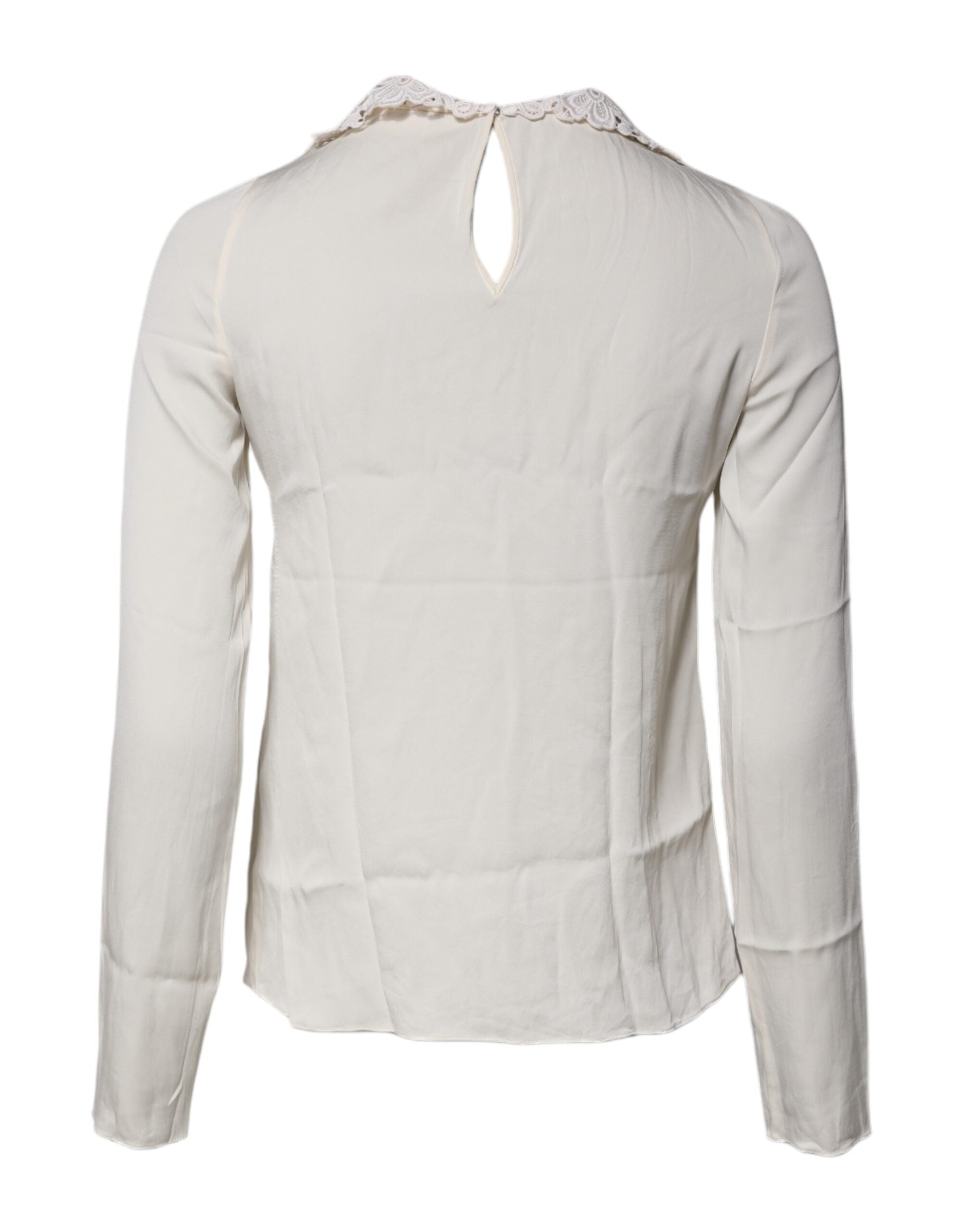 Blouse longue à manches longues Dolce & Gabbana en dentelle florale crème, élégante et délicate, vue de face.