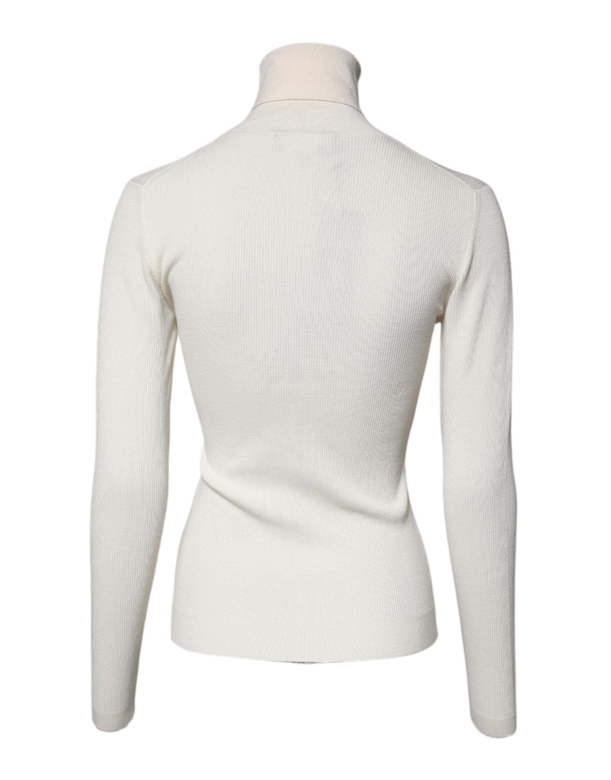 Pull en cachemire à manches longues et col roulé Dolce & Gabbana, coupe ajustée, couleur crème, détail élégant.