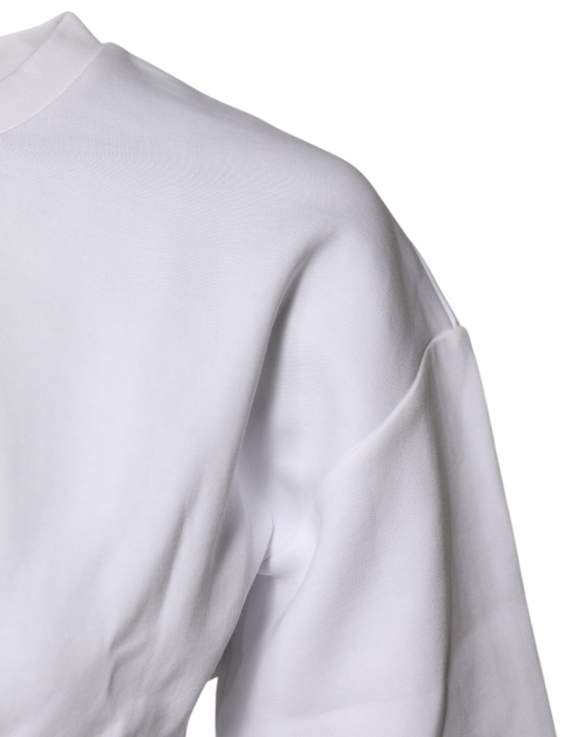 Chemisier Dolce & Gabbana en coton blanc à manches 3/4, style élégant et décontracté, visible avec détails de tissu.