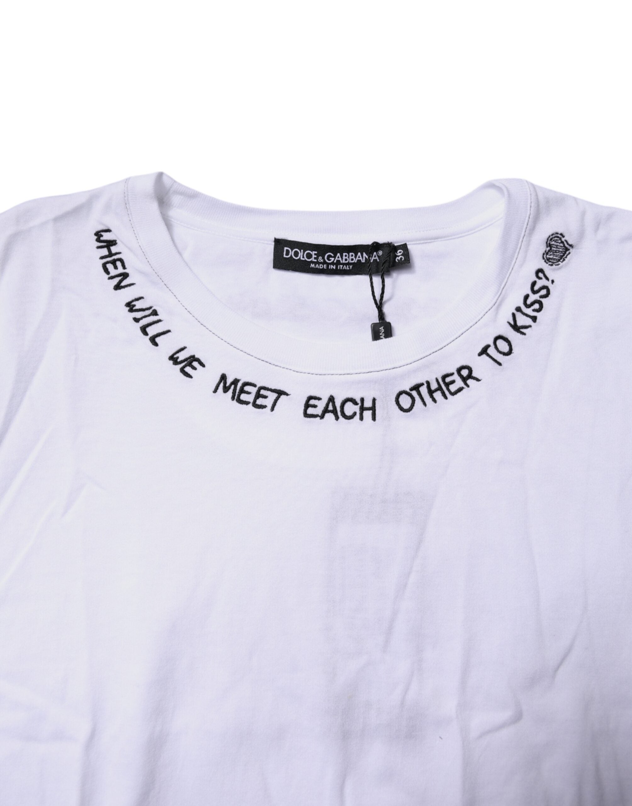 T-shirt sans manches Dolce & Gabbana en coton blanc avec imprimé floral, style décontracté et élégant, avec logo visible.