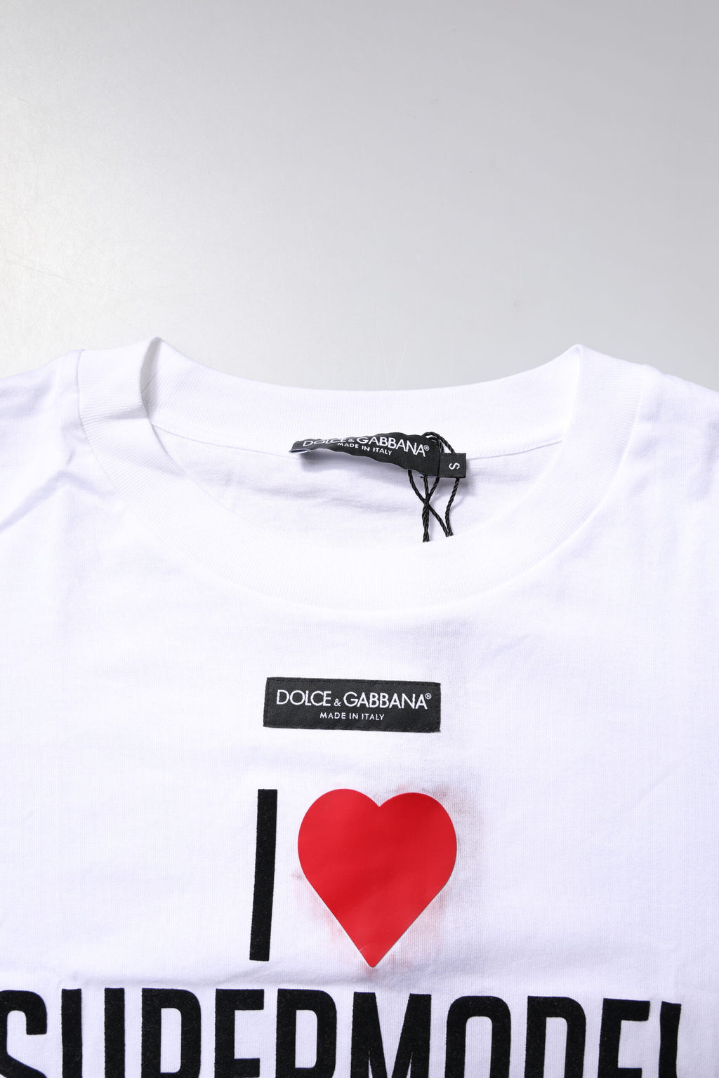 T-shirt blanc Dolce & Gabbana à col rond avec imprimé en coton, vue de face.