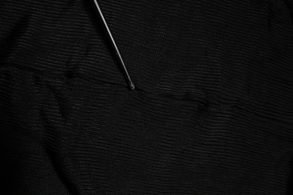 Pull en maille noir Dolce & Gabbana à manches longues et col roulé, coupe slim, vêtement chic pour femme.