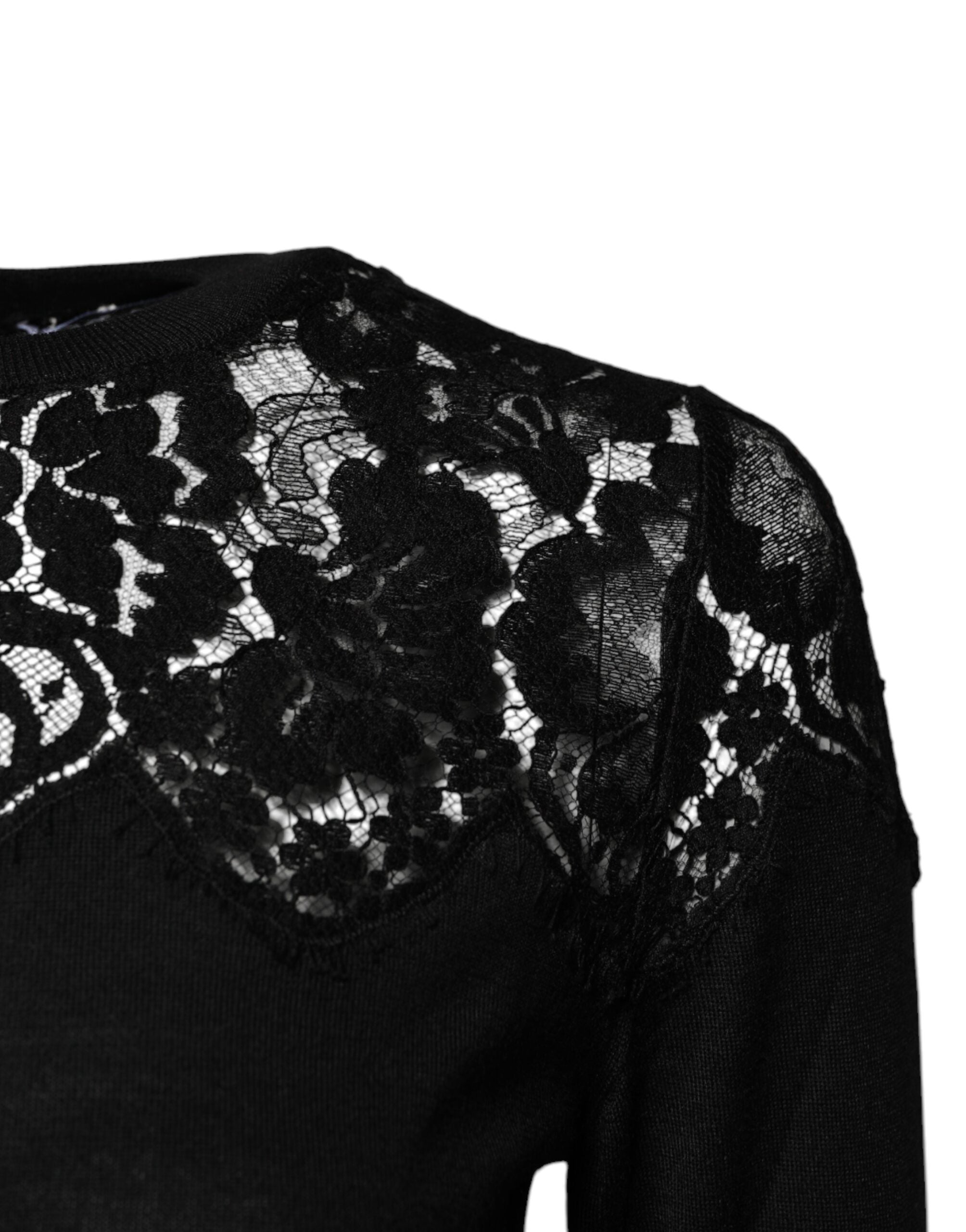 Blouse Dolce & Gabbana en dentelle noire à fleurs, manches longues et coupe élégante, vue de face.