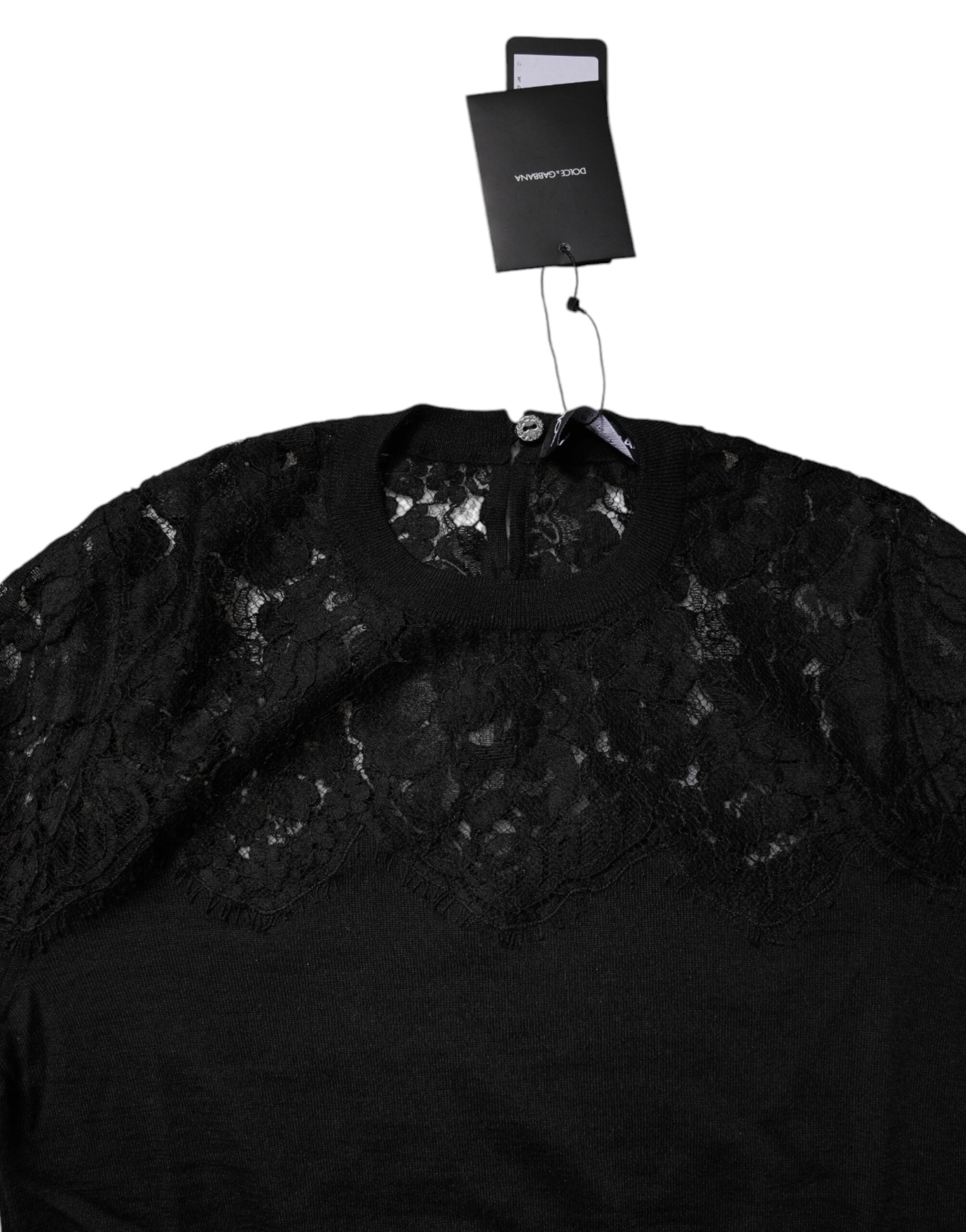 Blouse noire Dolce & Gabbana en dentelle florale à manches longues, élégante et délicate, pour un style sophistiqué.