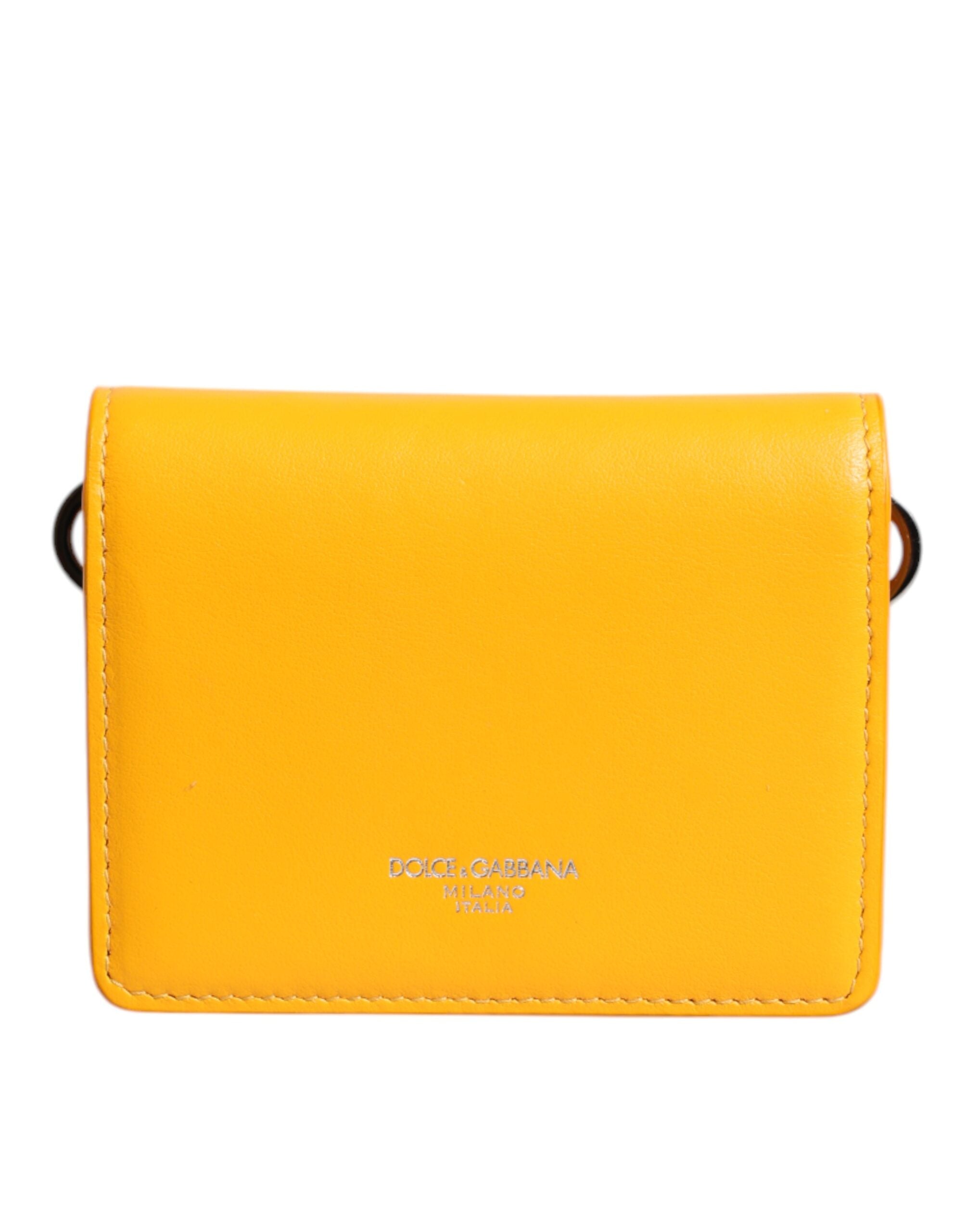 Porte-cartes en cuir jaune Dolce & Gabbana avec bandoulière, pliable et élégant, pour accessoires de mode.