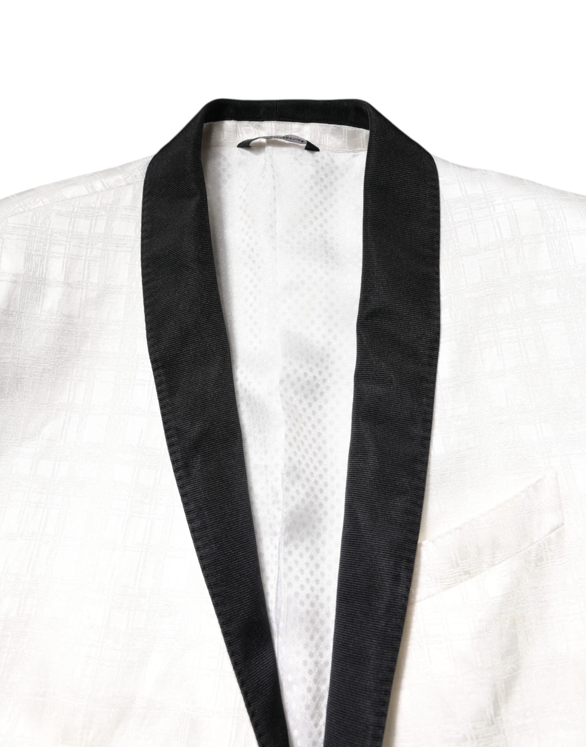 Manteau blazer blanc et noir Dolce & Gabbana à simple boutonnage, style élégant et chic, porté sur un mannequin.