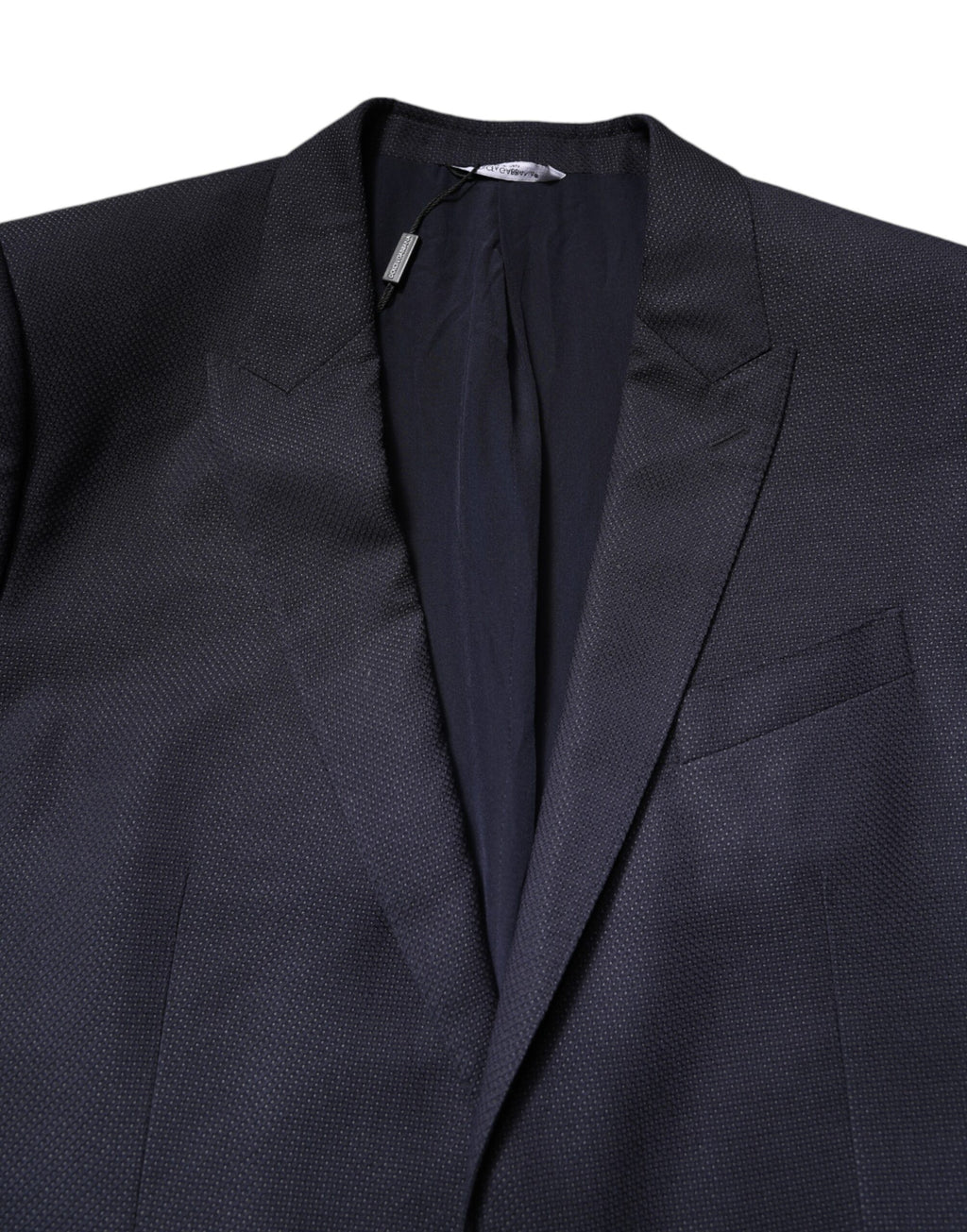Manteau blazer en laine noire Dolce & Gabbana à un seul bouton, coupe élégante et classique, porté sur un mannequin.