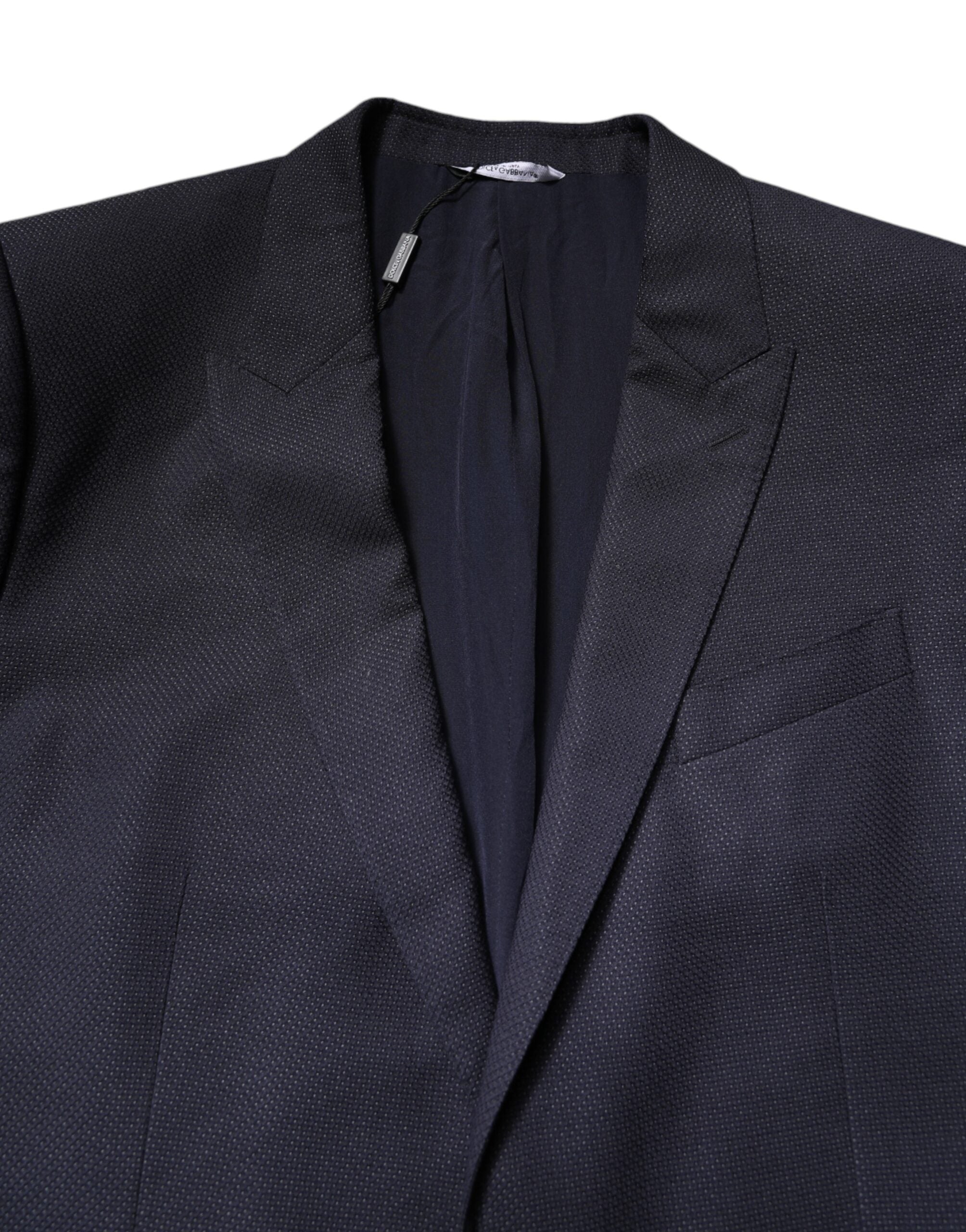 Manteau blazer en laine noire Dolce & Gabbana à un seul bouton, coupe élégante et classique, porté sur un mannequin.