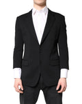 Manteau homme noir Dolce & Gabbana à un seul boutonnage, blazer élégant en tissu classique, vue de face.