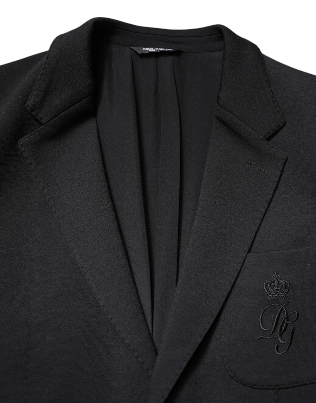 Manteau homme noir Dolce & Gabbana, blazer à un bouton, coupe élégante et classique, en tissu sophistiqué.