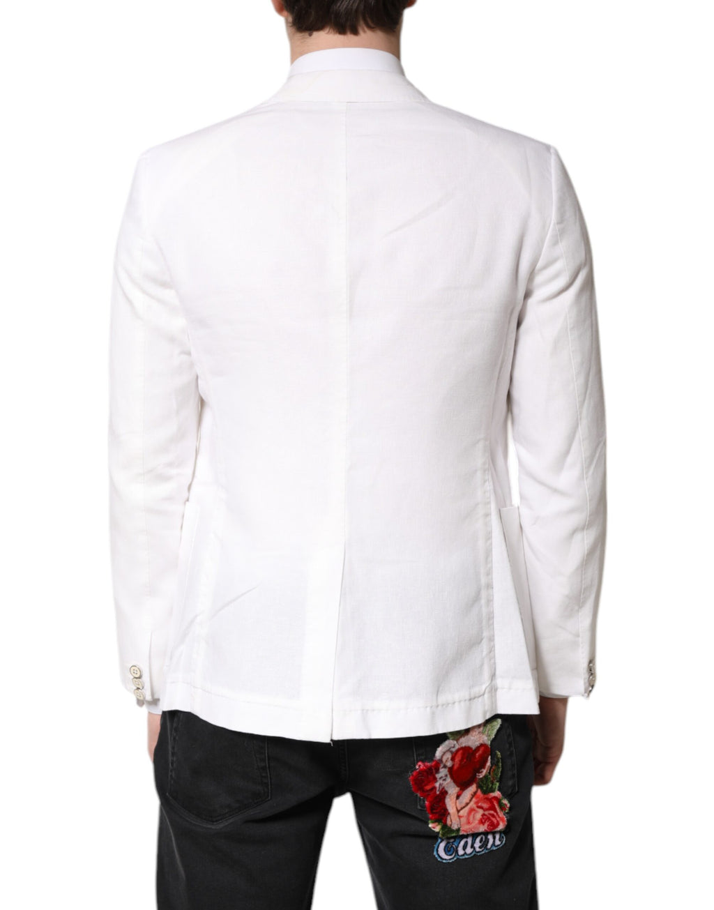 Costume homme blanc Dolce & Gabbana, blazer à double boutonnage, coupe élégante, tissu de qualité visible sur l'image.