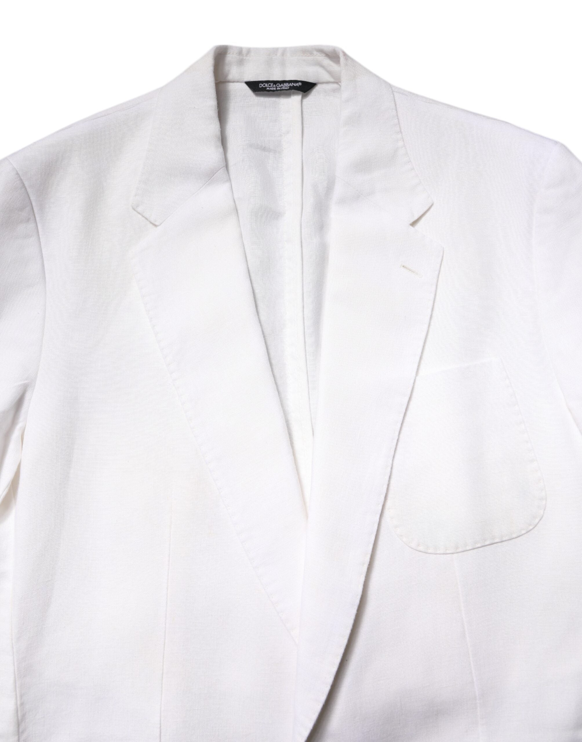 Blazer homme blanc Dolce & Gabbana à un seul bouton, style costume cintré, en tissu élégant, porté sur un mannequin.