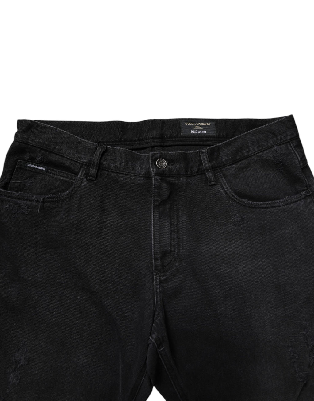 Jeans slim en coton noir Dolce & Gabbana pour homme, coupe ajustée et style élégant, visibles en gros plan.