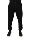 Pantalon jogging Dolce & Gabbana en coton noir, taille mi-haute, style décontracté avec poches et cordon de serrage.