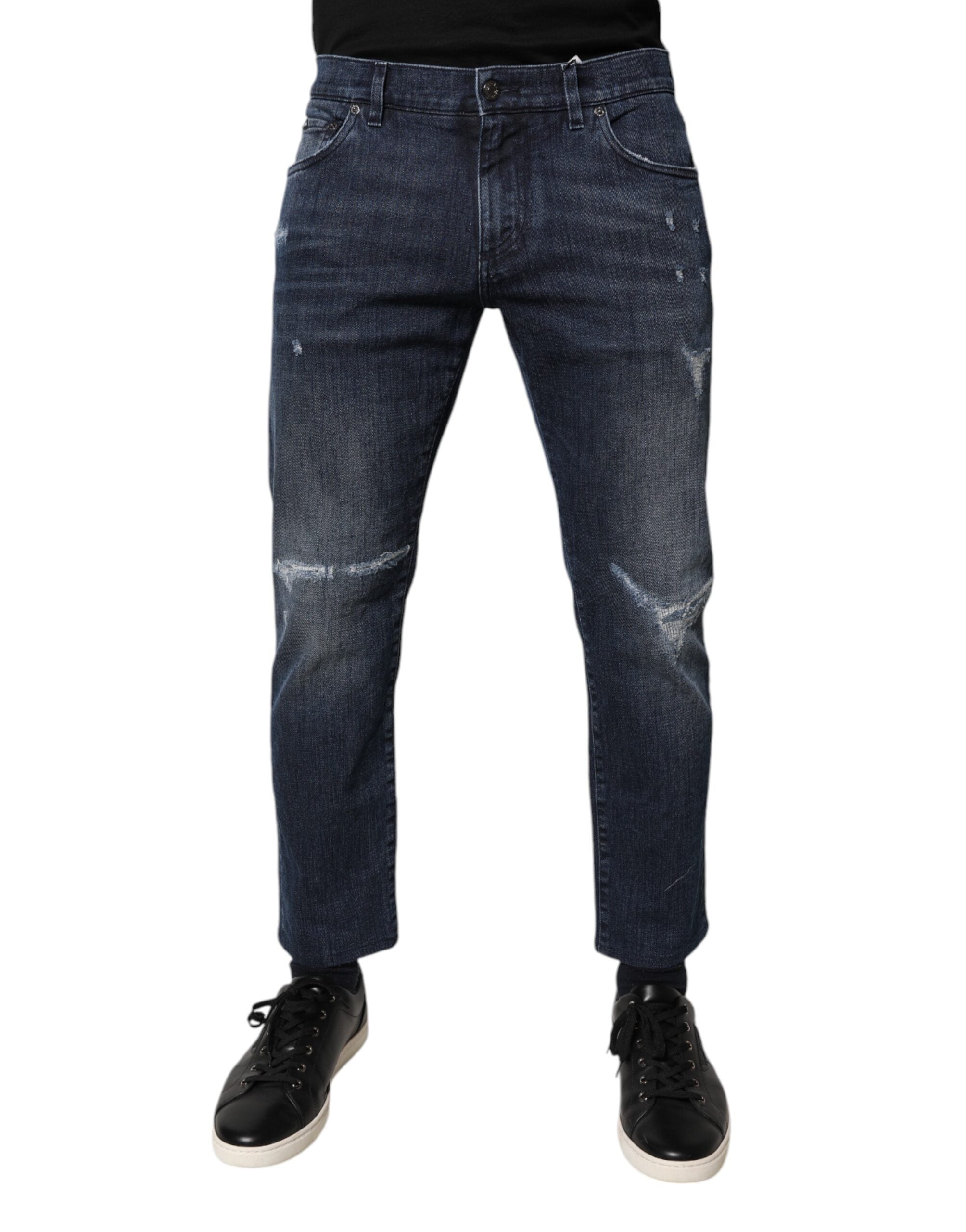 Jeans hommes Dolce & Gabbana en denim bleu en coton stretch, coupe skinny, affichés sur un fond neutre.