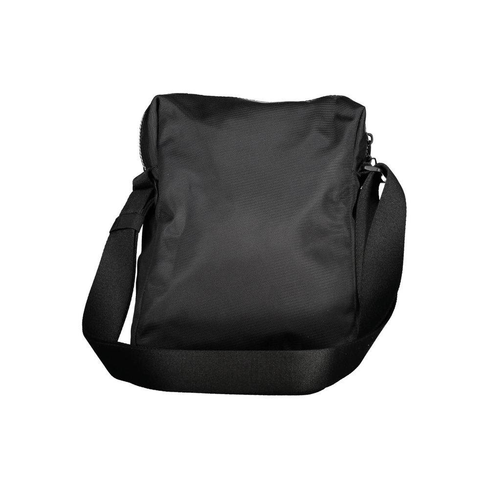 Sac à bandoulière pour homme Calvin Klein en polyester noir, avec poches et détails modernes visibles dans l'image.