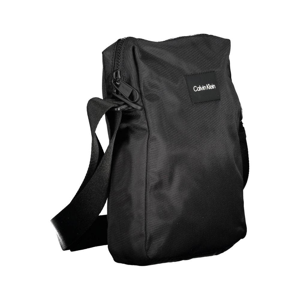 Sac à bandoulière homme Calvin Klein en polyester noir, avec poches et design élégant.