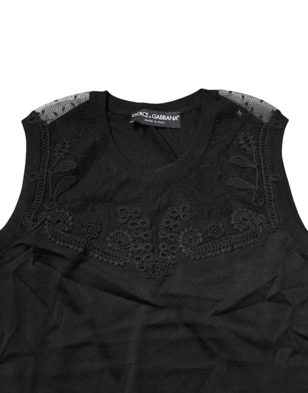 Haut sans manches en dentelle noire Dolce & Gabbana avec col rond transparent, style élégant et féminin.