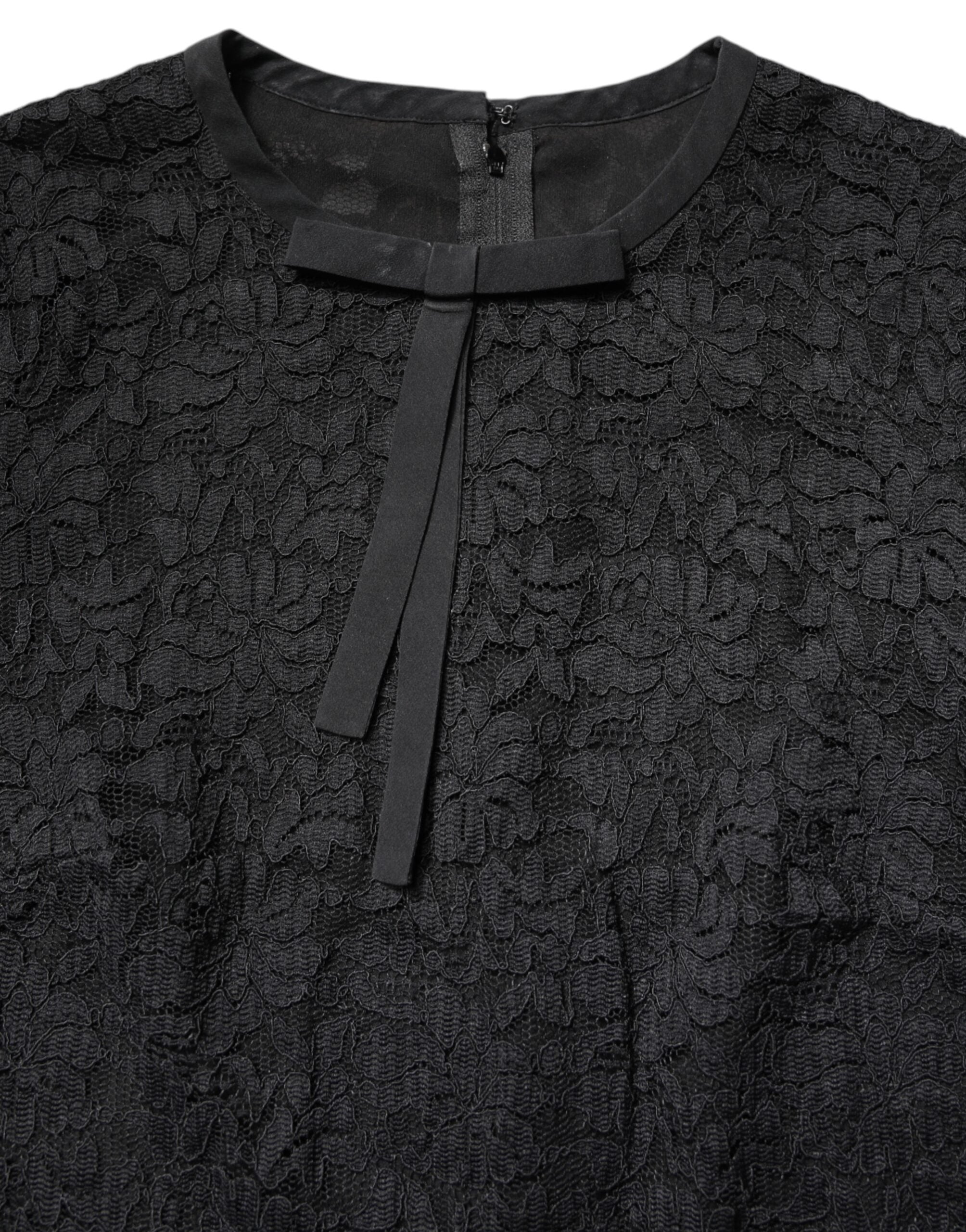 T-shirt à manches longues en dentelle noire Dolce & Gabbana avec col rond, style élégant et sophistiqué.